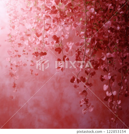 Delicate vines adorned with pink heart-shaped leaves gently cascade down against a soft pastel 122853154