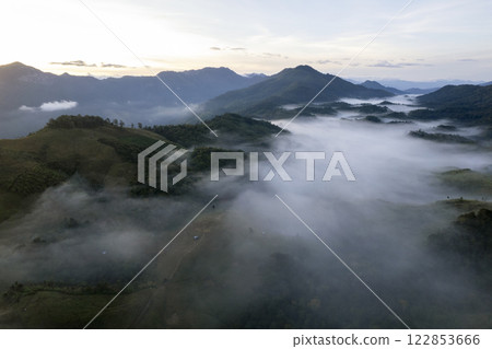 Landscape of Morning Mist with Mountain Layer at north of Thailand. mountain ridge and clouds in rural jungle bush forest 122853666
