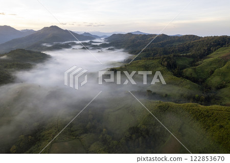 Landscape of Morning Mist with Mountain Layer at north of Thailand. mountain ridge and clouds in rural jungle bush forest 122853670