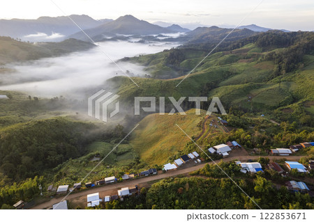 Landscape of Morning Mist with Mountain Layer at north of Thailand. mountain ridge and clouds in rural jungle bush forest Landscape of Morning Mist with Mountain Layer at north of Thailand. mountain ridge and clouds in rural jungle bush forest 122853671