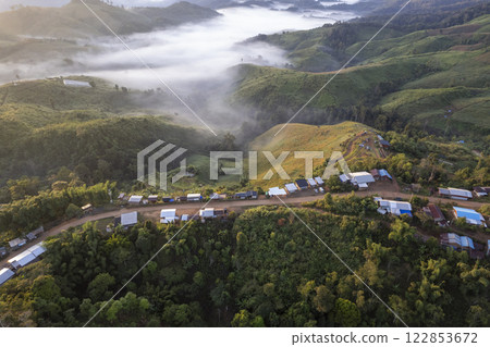 Landscape of Morning Mist with Mountain Layer at north of Thailand. mountain ridge and clouds in rural jungle bush forest Landscape of Morning Mist with Mountain Layer at north of Thailand. mountain ridge and clouds in rural jungle bush forest 122853672