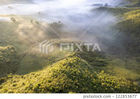 Landscape of Morning Mist with Mountain Layer at north of Thailand. mountain ridge and clouds in rural jungle bush forest 122853677