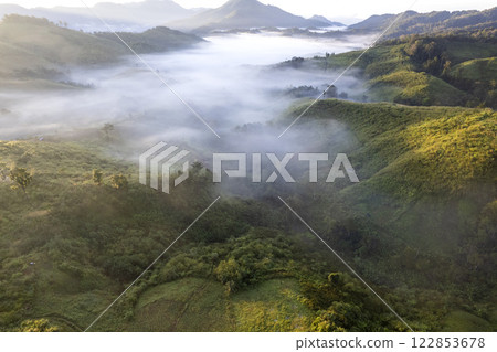 Landscape of Morning Mist with Mountain Layer at north of Thailand. mountain ridge and clouds in rural jungle bush forest 122853678