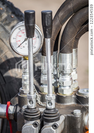 Control levers of the hydraulic machine 122854589