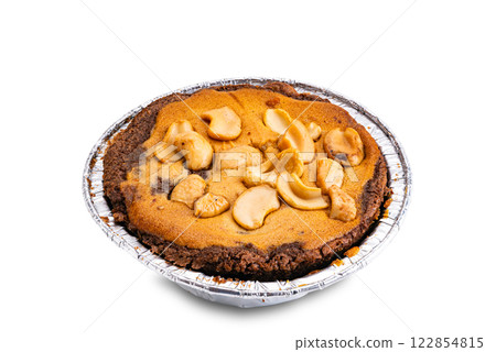 High angle view of nut chocolate cake in foil baking cup isolated on white background. 122854815