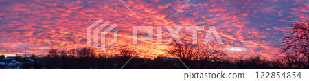Sunset panorama. Clouds of different bright colors, strange weather. Sunset panorama. Clouds of different bright colors, strange weather. 122854854