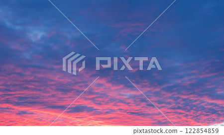 Breathtaking Sunset Sky with Pink and Blue Clouds Breathtaking Sunset Sky with Pink and Blue Clouds 122854859