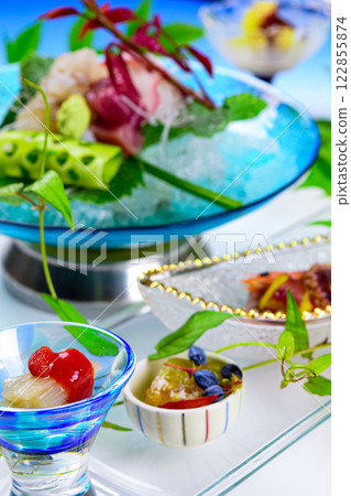 Japanese appetizers and sashimi served in cool glass dishes Japanese appetizers and sashimi served in cool glass dishes 122855874