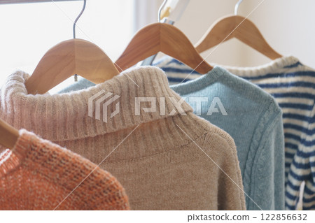 Hang the sweater on a hanger 122856632