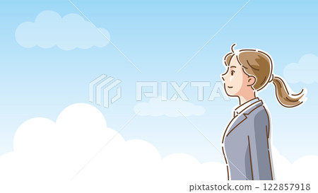 Profile of a woman in a suit looking ahead with a refreshing blue sky in the background Profile of a woman in a suit looking ahead with a refreshing blue sky in the background 122857918