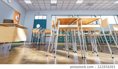 Empty classroom with wooden tables and chairs awaiting students Empty classroom with wooden tables and chairs awaiting students 122858263