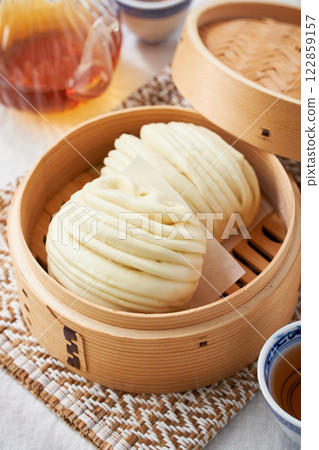 Fluffy Hanamaki steamed in a bamboo steamer - Chinese steamed bread Fluffy Hanamaki steamed in a bamboo steamer - Chinese steamed bread 122859157