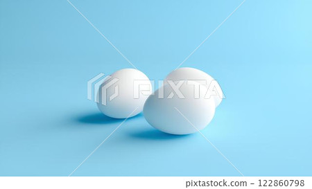 White eggs isolated on light blue background with space for text, lying horizontally. 122860798