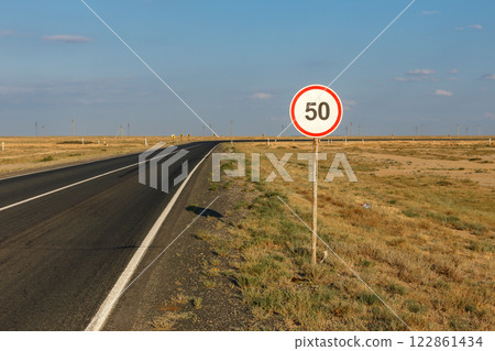 Speed limit sign along a desolate road in Atyrau Region Kazakhstan Speed limit sign along a desolate road in Atyrau Region Kazakhstan 122861434