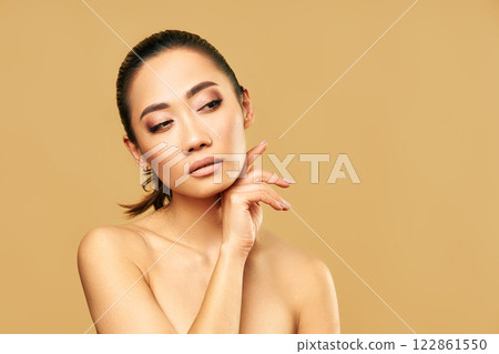 Beauty portrait of young woman with healthy skin and natural makeup looking on copy space 122861550