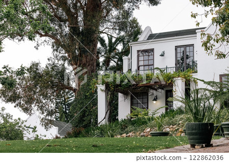 residential building classic architectural style. white facade, dark tiled roof 122862036