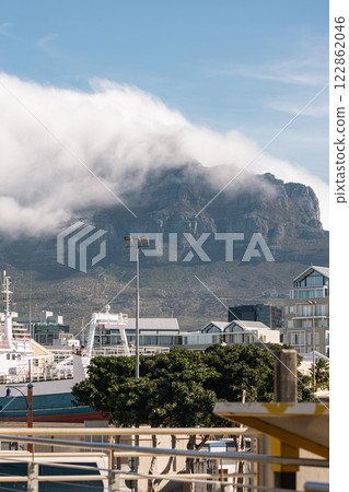 Cape Town waterfront cityscape, buildings and Table Mountain in clouds 122862046