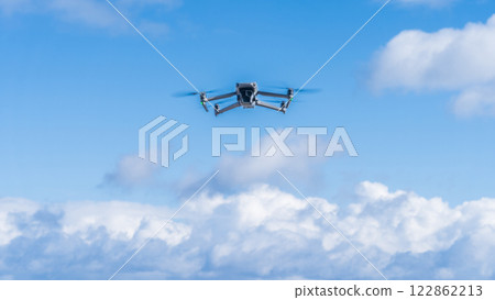 Drone flying blue sky 122862213