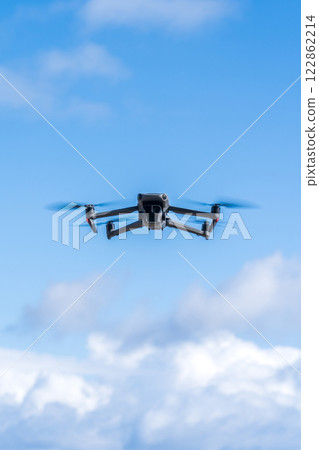 Drone flying blue sky 122862214