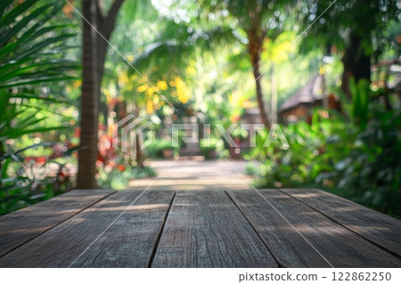Wood table top texture on blur leaf tree garden background. 122862250