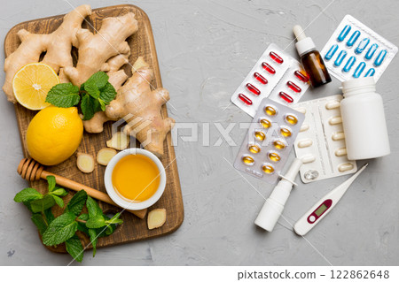 Natural cold and flu home remedies. Natural ingredients for immunity stimulation and viruses protection. top view flat lay Natural cold and flu home remedies. Natural ingredients for immunity stimulation and viruses protection. top view flat lay 122862648