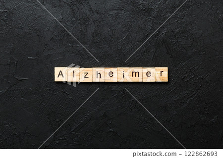 Alzheimer word written on wood block. Alzheimer text on cement table for your desing, concept Alzheimer word written on wood block. Alzheimer text on cement table for your desing, concept 122862693