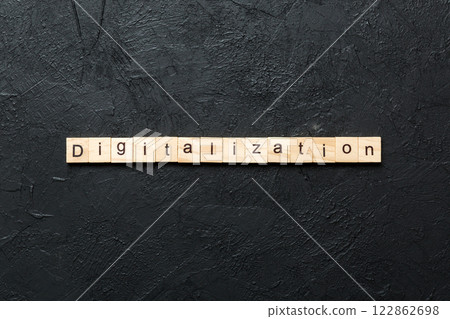 digitalization word written on wood block. digitalization text on cement table for your desing, concept digitalization word written on wood block. digitalization text on cement table for your desing, concept 122862698