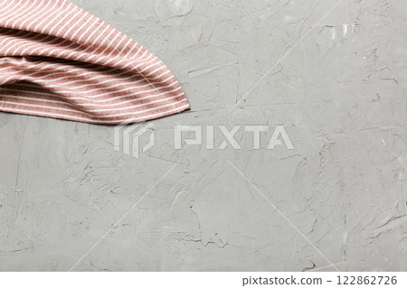 top view with red empty kitchen napkin isolated on table background. Folded cloth for mockup with copy space, Flat lay. Minimal style top view with red empty kitchen napkin isolated on table background. Folded cloth for mockup with copy space, Flat lay. Minimal style 122862726