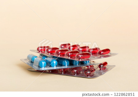 too many different pill cartridges stacked. selective Focus. Packs of blister pills with tablets. Colored pastilles packages. A pile of medicine in blister packs. Pharmaceutical blister packs too many different pill cartridges stacked. selective Focus. Packs of blister pills with tablets. Colored pastilles packages. A pile of medicine in blister packs. Pharmaceutical blister packs 122862851