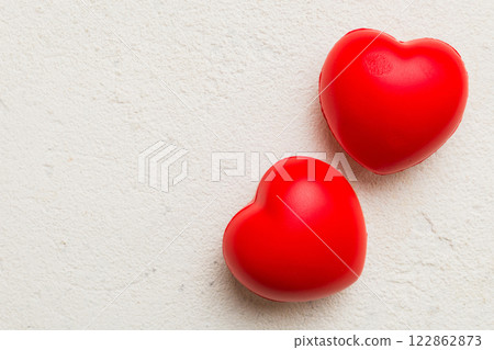 red heart shape on colored background. minimal concept top view with copy space red heart shape on colored background. minimal concept top view with copy space 122862873