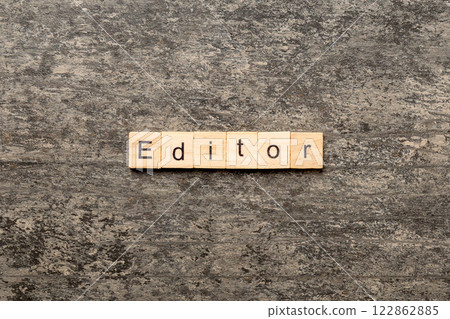 editor word written on wood block. editor text on table, concept 122862885