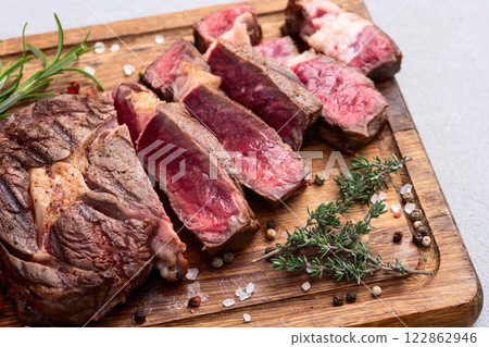 Ribeye grilled  beef steak sliced . Rare doneness photography . Top view 122862946