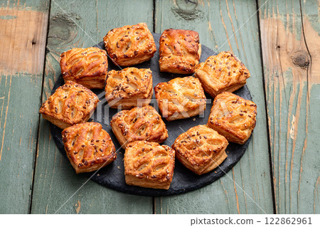 Flaky Pastries with Sesame Seeds on Slate Flaky Pastries with Sesame Seeds on Slate 122862961