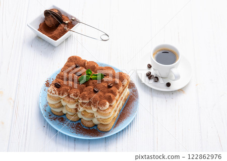 Classic Tiramisu Dessert on Rustic Plate 122862976