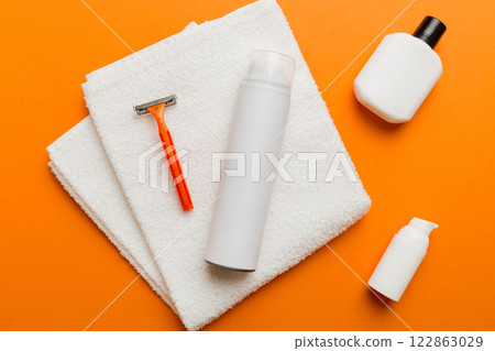 shaving man set. shaving machine, towel, lotion and shaving foam on colored background. Men bath Accessories top view shaving man set. shaving machine, towel, lotion and shaving foam on colored background. Men bath Accessories top view 122863029