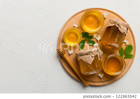 honey jar with acacia flowers and leaves. fresh honey top view flat lay 122863042