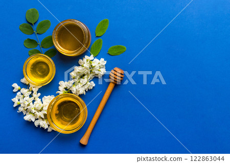 honey jar with acacia flowers and leaves. fresh honey top view flat lay 122863044
