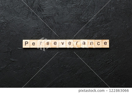 perseverance word written on wood block. perseverance text on table, concept 122863066
