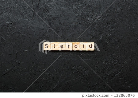 steroid word written on wood block. steroid text on table, concept 122863076