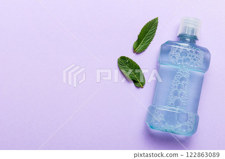 Mouthwash and fresh mint on colored background, top view with copy space for text 122863089