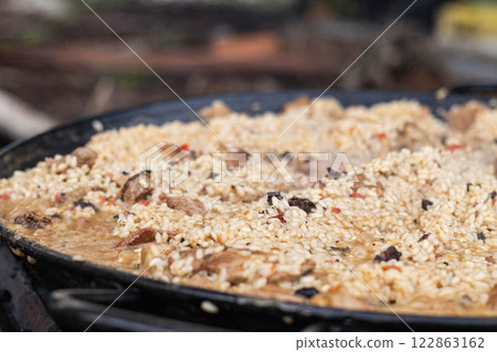 Delicious dish cooking with rice and meat ingredients 122863162