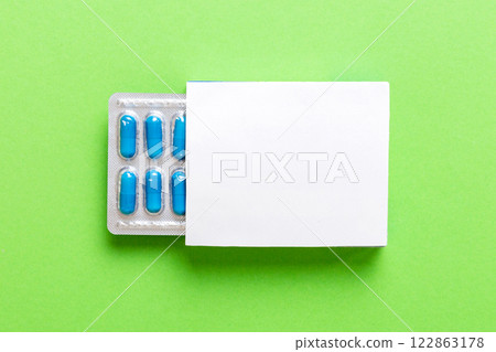 Blank White Product Package Box Mock-up. Open blank medicine drug box with blue pills blister top view 122863178