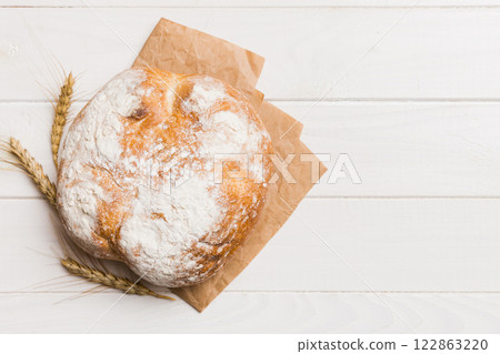 Fresh homemade crisp round bread on napkin, top view. Healthy unleavened bread. French bread. Top view Bakery products 122863220
