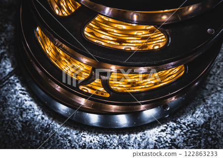 A stack of led lights in flexible lighting strips rolled up.  122863233