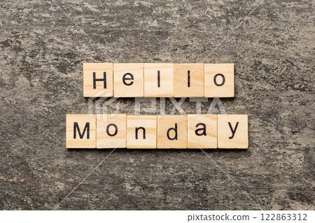 hello monday word written on wood block. hello monday text on cement table for your desing, concept 122863312