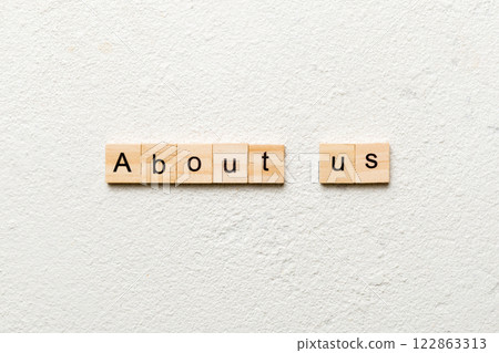 About us word written on wood block. About us text on cement table for your desing, concept About us word written on wood block. About us text on cement table for your desing, concept 122863313