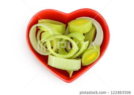 sliced Leek vegetable in ceramic bowl isolated on white background. Top view. Flat lay sliced Leek vegetable in ceramic bowl isolated on white background. Top view. Flat lay 122863506