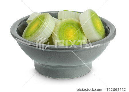 sliced Leek vegetable in ceramic bowl isolated on white background with full depth of field 122863512