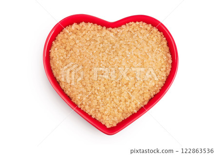 The brown sugar in ceramic bowl isolated on white background. Top view. Flat lay 122863536