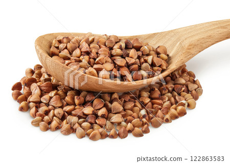 Raw buckwheat in wooden spoon isolated on white background 122863583